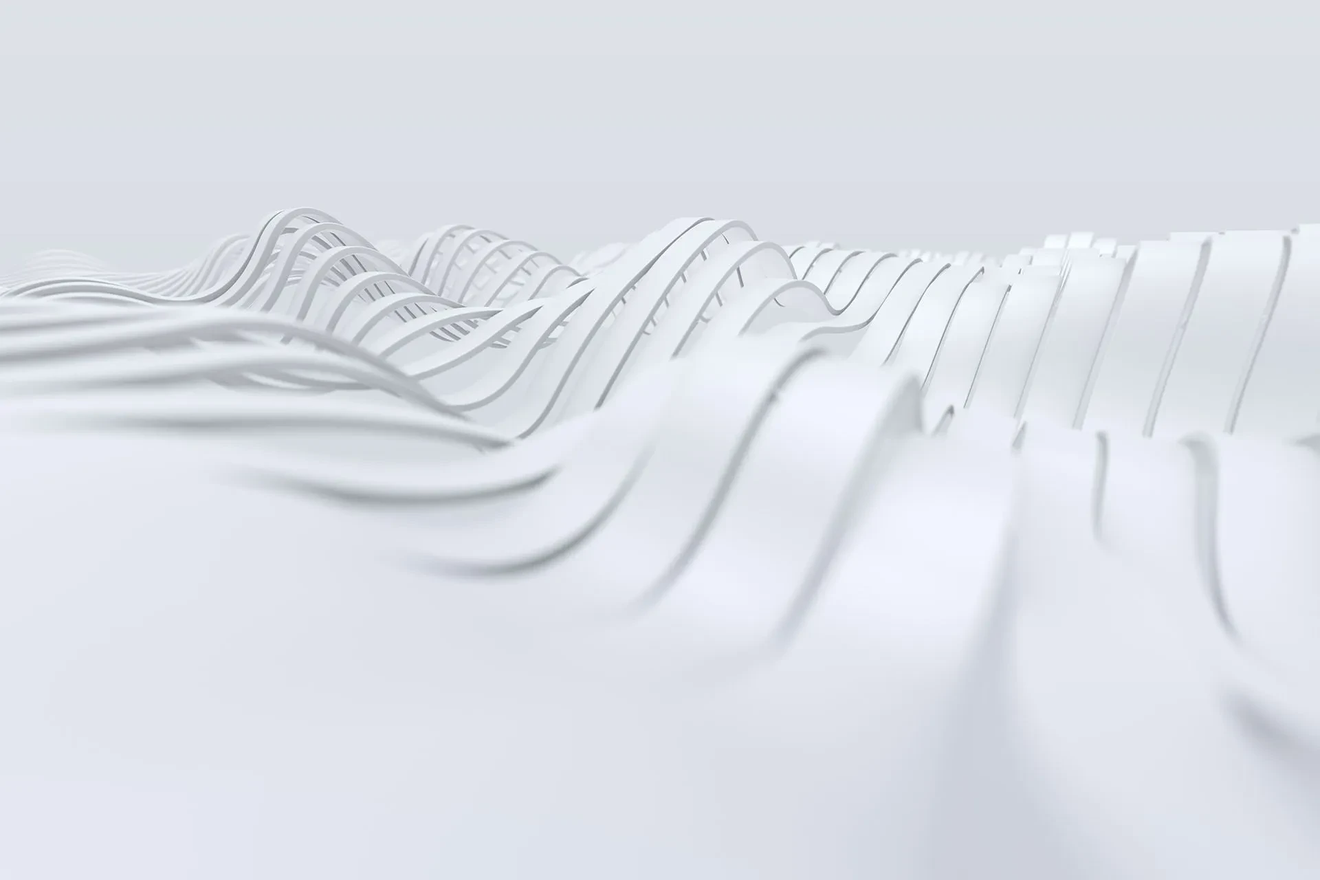 Close-up of white waves resembling a futuristic, abstract landscape with clean lines.